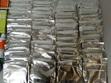 many packets of silver foil sitting on a table