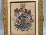 an antique framed picture of a coat of arms with a crown on it