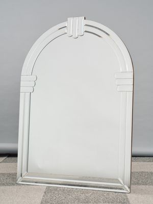 an image of a white mirror sitting on top of a tiled floor