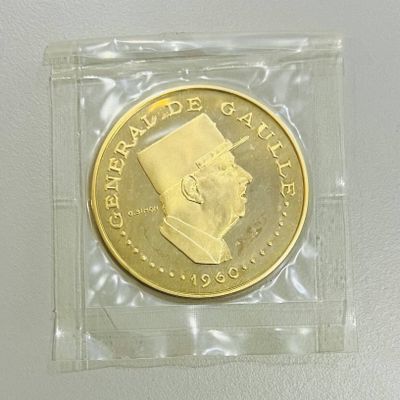 une pièce d'or à l'effigie d'un homme portant un turban