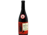 a bottle of wine sitting on top of a white table