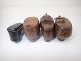 several wooden containers are lined up on a white surface