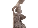 statue of a man sitting on a rock on a white background