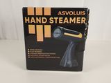 a black and yellow hand steamer sitting on top of a white table