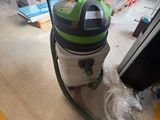 a vacuum that is sitting on the floor in the room