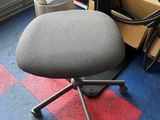 a chair that is sitting in front of a window