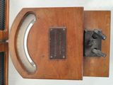 a wooden door with a metal handle and a plaque on it