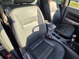 the interior of a car with black leather seats and black trims