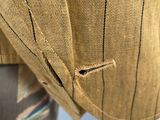 a close up of a man ' s jacket and tie