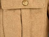 a close up of a jacket with buttons on it