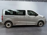a silver van that is parked inside of a building