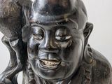 a statue of a man holding a bird in his hand