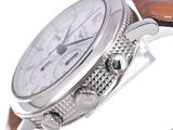 a close up of a wrist watch with a brown strap