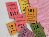 a lot of luggage tags that are on a table