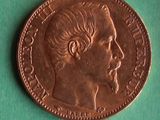 a close up of a coin with a man ' s face on it