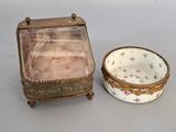 a small box and a small bowl sitting on a table