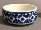 a blue and white bowl sitting on a table