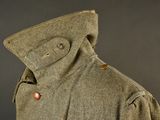 an image of a military coat with buttons on the collar
