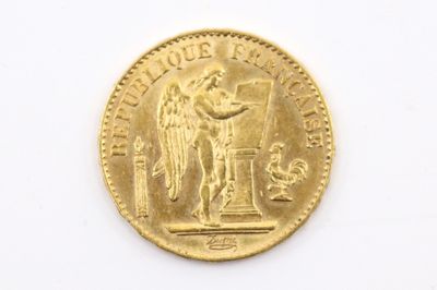 une image représentant une pièce d'or surmontée d'une statue