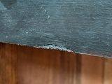 a close up of a piece of wood on a shelf