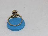 a ring that is sitting on top of a blue object