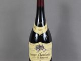 a bottle of wine that is sitting on a table