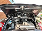 the engine of a car with its hood open and the hood down