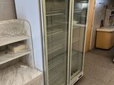 a refrigerator that is sitting in the middle of a room