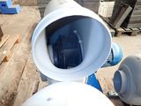 an image of a blue and white toilet in a construction site