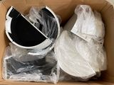 a cardboard box filled with a bucket of water and other items