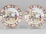 pair of chinese porcelain plates with figures on them on stands
