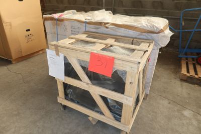 a wooden crate sitting on top of a pallet in a warehouse