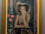 painting of a woman sitting on a balcony with a rose in her hand
