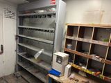 a room that has a bunch of shelves in it