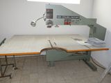 an image of a work room with a table and a chair