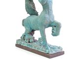 statue of a horse with a rider on it ' s back and a bird on its back