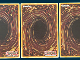 three cards with a picture of a spiral design on them