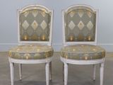 pair of louis xvi style painted chairs with upholstered cushions