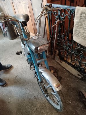 a bike that is parked next to a fence