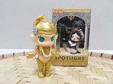 a little doll that is standing next to a box