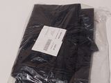a bag of black cloth sitting on a table