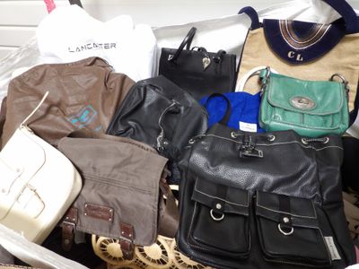 a lot of purses that are sitting in a bag