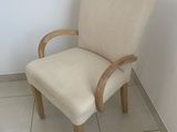 a chair that is sitting in the corner of a room