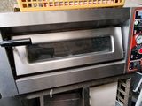 an image of a commercial oven with a basket on top of it