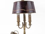 a lamp that is on a table with a lamp shade on it