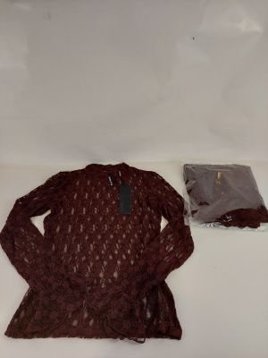 a sweater and a bag on a white surface