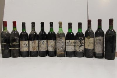 several bottles of wine are lined up in a row on a table