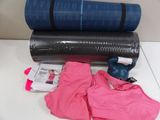 two yoga mats and a pair of gloves on a table