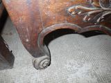 a close up of a wooden table with a drawer underneath it