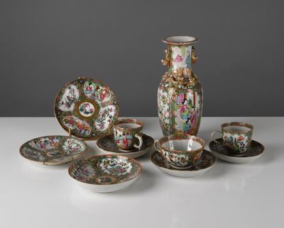 many different pieces of china sitting on a table